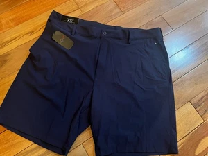 Nuevos pantalones cortos de golf GREG NORMAN talla 40 azul marino/logo de tiburón elásticos para hombre precio de venta sugerido por el fabricante $65 - Imagen 1 de 10