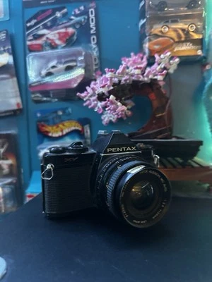 Cámara SLR negra película de 35 mm Asahi Pentax MV de colección con lente de 50 mm SIN PROBAR Foto 1 de 4