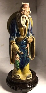 Chinese Mudman 7 1/4” Standing With Beautiful Colors With Fish On Wood Stand - Picture 1 of 12