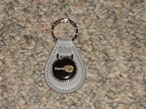 1970 1971 1972 1973 1974 1975 1976 PLYMOUTH DUSTER CLOUD LOGO KEYCHAIN DARK GREY - Picture 1 of 1