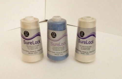 Lot of 3 Coats Surelock Polyester Threads, 3000 Yds, 2 Natural and 1 Dusty Blue - Image 1 of 1