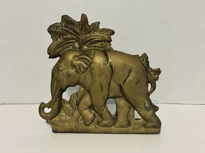 brass-toned elephant door stop or bookend, often crafted from cast iron. - Image 1 of 4