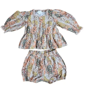 Juego de 2 piezas Kate Quinn 6-12M floral peplum top y pantalones cortos bloomer algodón orgánico - Imagen 1 de 12