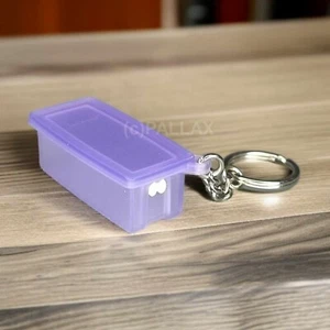 TUPPERWARE SCHLÜSSELANHÄNGER PRIMA KLIMA BEHÄLTER LILA - Bild 1 von 2
