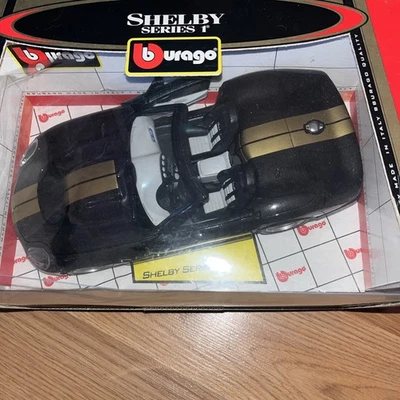Burago Shelby Serie 1 - 1/18 Diecast Negro/Dorado - Foto 1 de 3