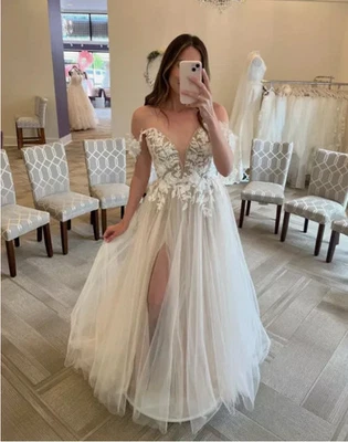 Vestidos de novia blancos de playa cuello en V fuera del hombro una línea largo vestido de novia Foto 1 de 3