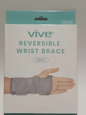 Nuevo MUÑEQUERA REVERSIBLE VIVE Gris ~ Se adapta tanto a mano derecha como a izquierda ~Nuevo en caja Foto 1 de 4