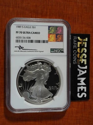 1989 S PROOF SILVER EAGLE NGC PF70 ULTRA CAMEO JOHN MERCANTI SIGNED ART LABEL - Image 1 of 2