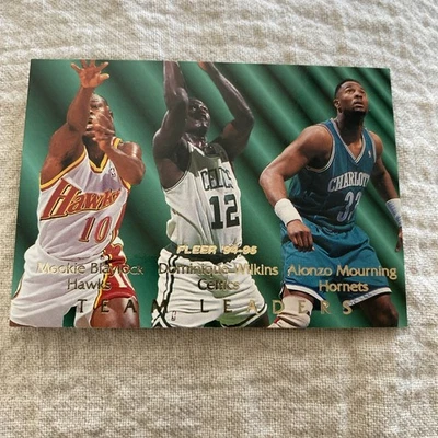 1994-95 FLEER TEAM LEADERS CARD BLAYLOCK WILKINS MOURNING #1 - Image 1 of 2