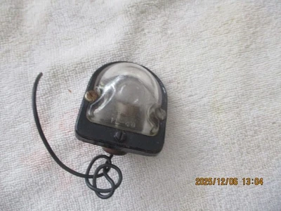 USED 1948 GENERL MOTORS LICENSE PLATE LAMP - Image 1 of 4