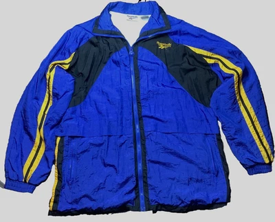 Chaqueta cortavientos Reebok años 90 de nailon para hombre azul negro amarillo talla M mediana vintage Foto 1 de 4