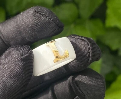 Anillo de cerámica blanca con último oro L Foto 1 de 2