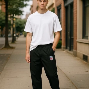 Pantalones de nailon negros NFL para hombre talla pequeña - Imagen 1 de 6