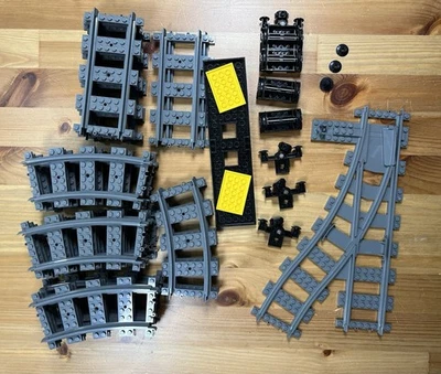 Lego Train Tracks 18 Curvo, 7 Recto, Interruptor, Ruedas y algunas piezas extra Foto 1 de 4