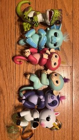 Lot Of 6 Fingerlings Including A Monkey, Dinosaur , Unicorn, Dragon and Seesaw