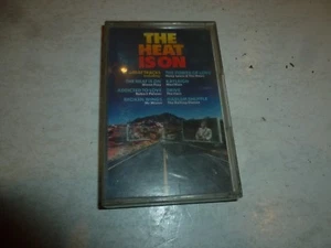 THE HEAT IS ON - 1986 UK 16-track cassette - Picture 1 of 3