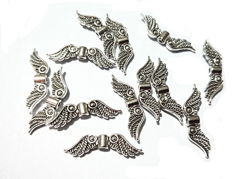 20pz perline metallo spacer separatori  ali angelo 23x7mm colore argento tibet - Immagine 1 di 1