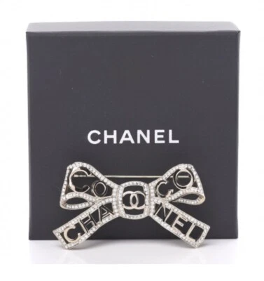 Broche CC Chanel 2020B Champagne Metal Cristal Arco Coco Foto 1 de 4