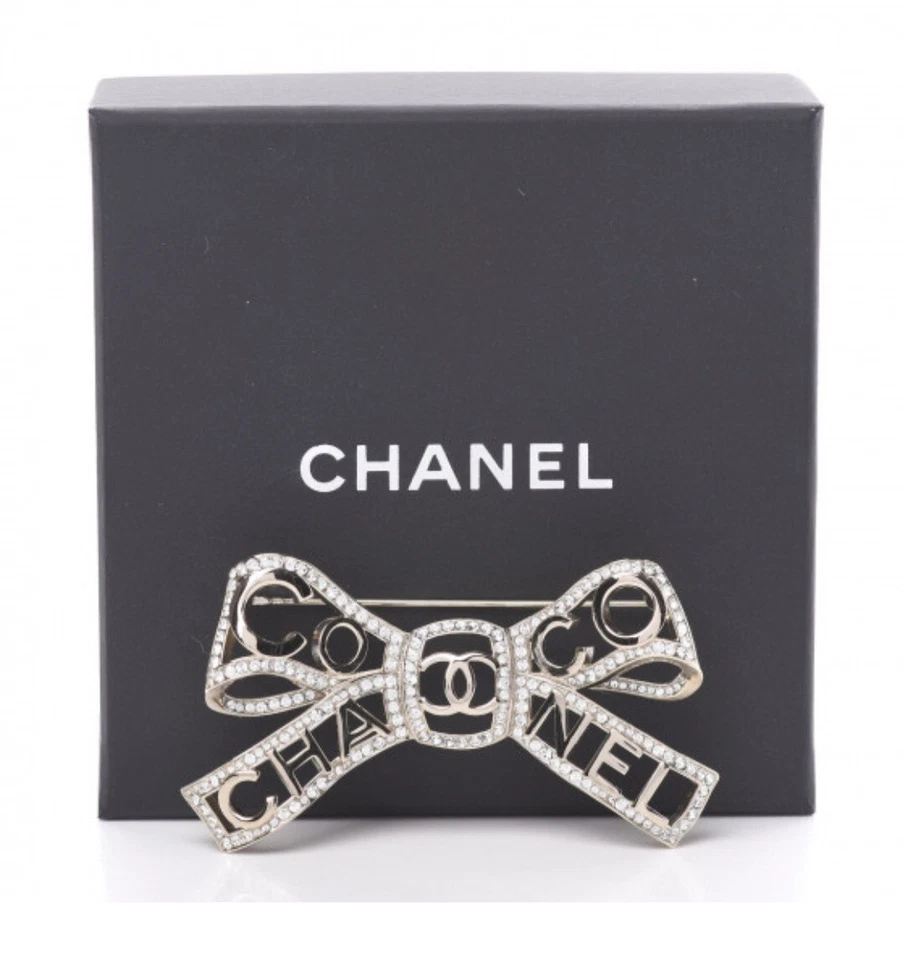 Broche CC Chanel 2020B Champagne Metal Cristal Arco Coco Foto 1 de 4