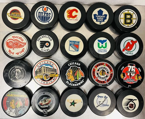 Lot of 20 Vintage (mostly 90s) NHL Hockey Pucks Hartford, Chicago, Boston, NJ + Cover