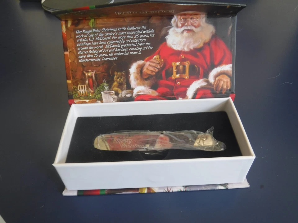 LIMITED EDITION ROUGH RIDER RR1876 CHRISTMAS KNIFE W/ R.J. McDonald artwork - Image 1 of 4