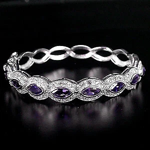 925 STERLING SILVER 7.80 CTW IOLITE & WHITE TOPAZ BANGLE, 6-6.5'' - Image 1 of 2