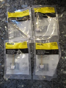 4 STANLEY SOLID DOORSTOP - 4 PACKS - BRASS FINISH - WHITE STOPPER - Picture 1 of 4