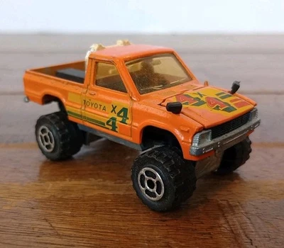 Camioneta pickup Toyota Hilux 4x4 naranja Majorette #287 diecast de colección 1/56 difícil de encontrar  Foto 1 de 4