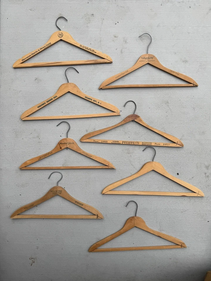 Lot of 8  Vintage Wooden Clothes Hangers with Printed Advertising  - Image 1 of 1