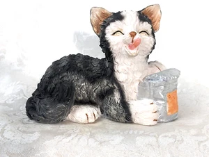 Kitten Enjoying a Treat - Picture 1 of 6