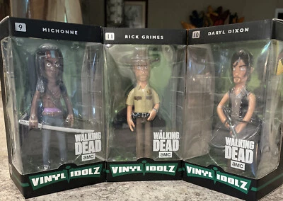 Lote de 3 figuras de vinilo Idolz The Walking Dead Daryl, Rick y Michonne Foto 1 de 4