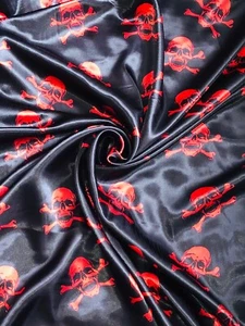 1 Meter Black/Red Skull & Cross Bones Polyester Satin Fabric 58” Wide Halloween - Picture 1 of 2