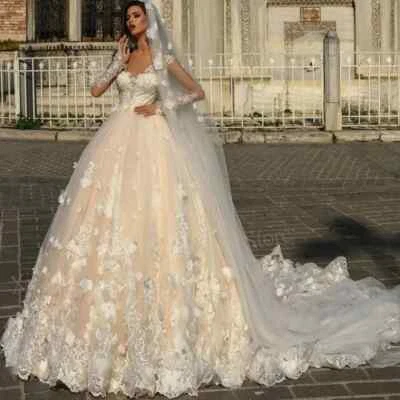 Elegant A-Line Wedding Dresses Boat Neck Long Sleeved Lace 3D Floral Sweep Train - Image 1 of 4