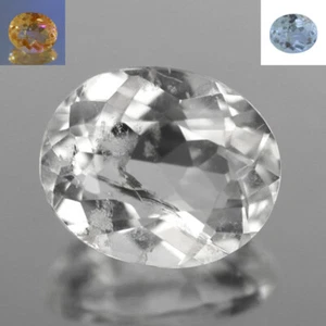 0.60 Ct Oval 6.2 x 5.1 MM 100% Natural White - UV Orange to UV Blue Scapolite !! - Picture 1 of 5