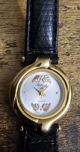 Landstroms Damen Armbanduhr Black Hills Gold mit Lederband braucht Batterie  - Bild 1 von 10