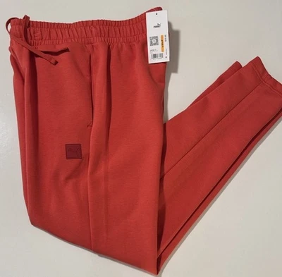 Pantalones deportivos Puma para hombre pequeños naranja cónicos Foto 1 de 4