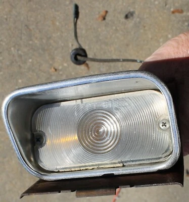 1964 Mercury Comet Front LEFT Parking Light Housing Turn Signal Bezel & Bracket - Image 1 of 4