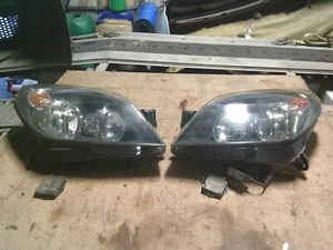 ASTRA MK5 VXR GENUINE GM FACTORY BLACK INSERT HEADLIGHTS PAIR - Picture 1 of 5