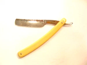 vintage Worcester Razor Co. straight razor with yellowish plastic handle - Picture 1 of 11