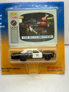 1998 JOHNNY LIGHTNING THE BLUES BROTHERS STAATSPOLIZEIAUTO NEU AUF BESCHÄDIGTER KARTE - Bild 1 von 5