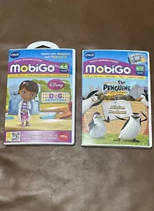 Vtech MobiGo Learning Games Penguins Of Madagascar & Doc McStuffins Complete - Picture 1 of 2