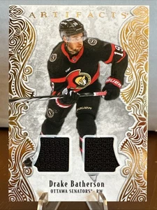2025-26 Upper Deck Artifacts Gold Material #60 Drake Batherson /299 - Bild 1 von 2