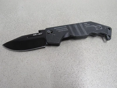 Cuchillo plegable Cold Steel AK-47 AUS-8A Taiwán 2008 dos agujeros de cordón Foto 1 de 4