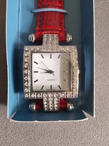 LADY'S STUNNING AVON LOUISA WRIST WATCH WITH RED STRAP AND SQUARE DIAMANTE FACE - Picture 1 of 3