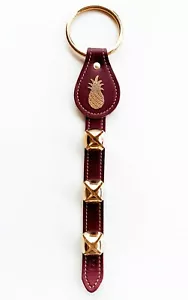 CINTURINO CAMPANA IN PELLE DI ANANAS BORDEAUX CON CAMPANE PLACCATE - Foto 1 di 1