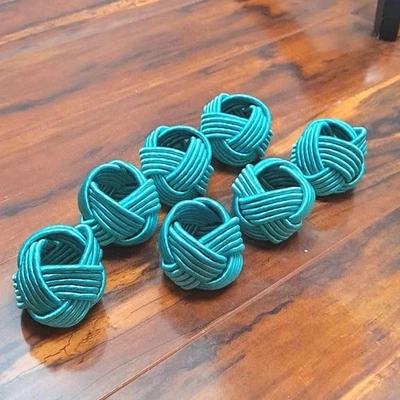 Juego de 7 servilleteros tejidos verde azulado Foto 1 de 3