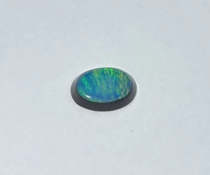 Australian Lightning Ridge Doublet Opal White Oval Cabochon 7x5x3mm 0.70ct - Picture 1 of 1