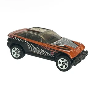 Coche de juguete diecast Jeep Jeepster 1999 Hot Wheels naranja negro estampado de cebra - Imagen 1 de 9