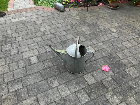 Vintage 2 Gallon Galvanised Watering Can has couple of small holes in bottom Cover