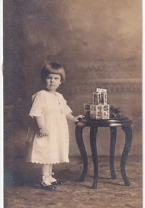Vintage Photograph Little Girl White Dress Toys Standing 1900s 3.75x6" - Picture 1 of 2